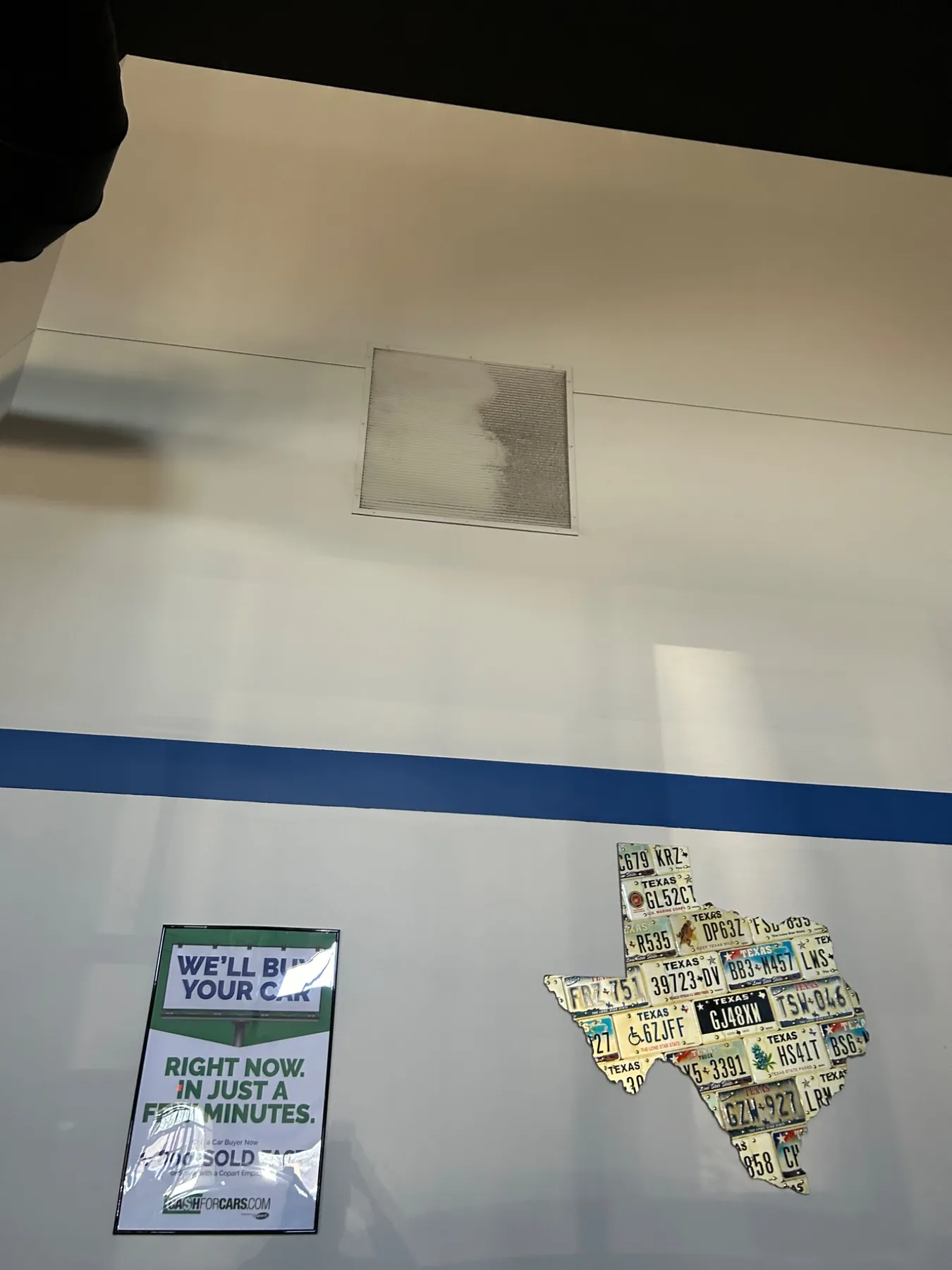 Partially cleaned high wall vent showing before-and-after dust removal