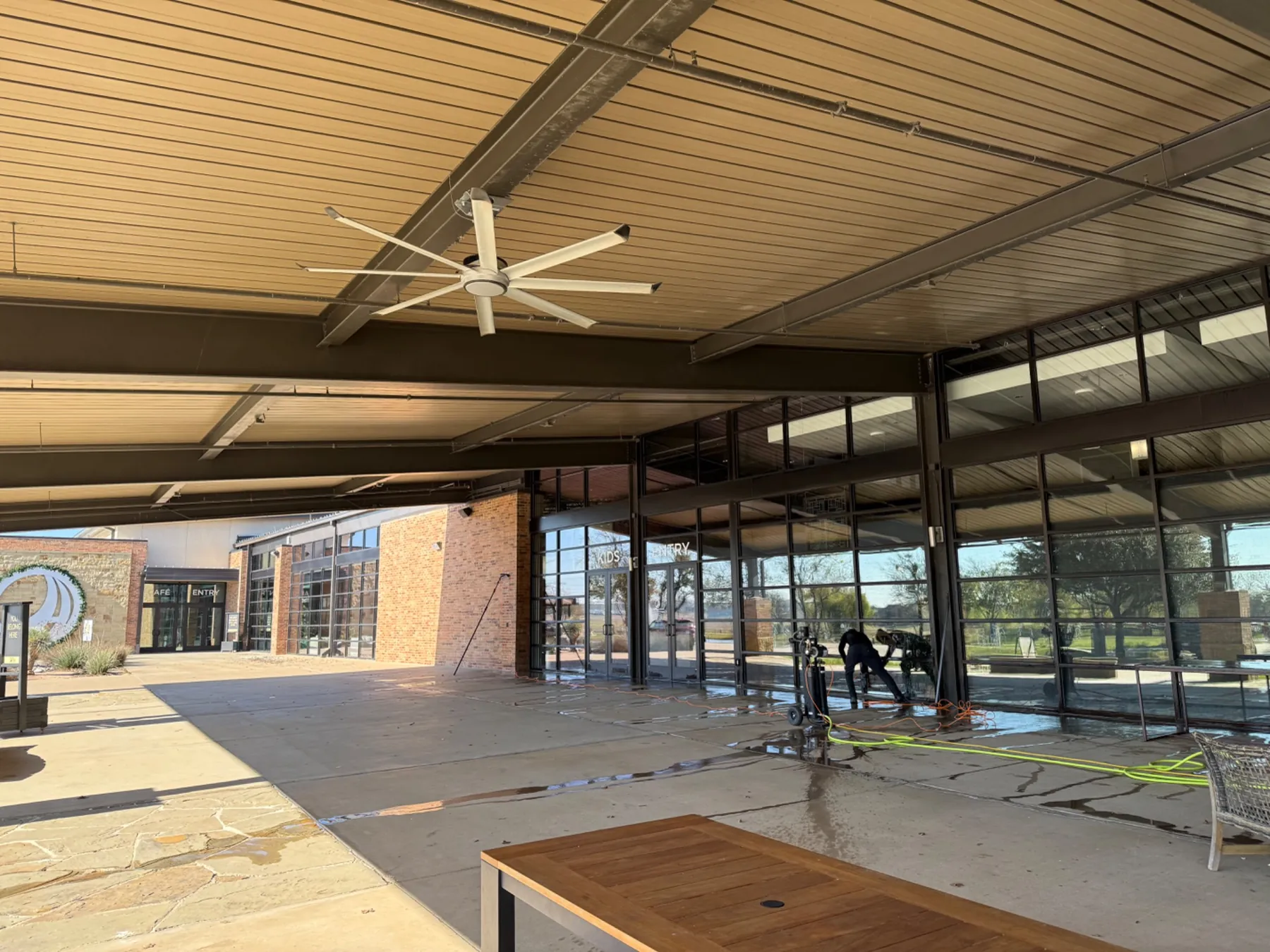 Crew cleaning commercial storefront glass