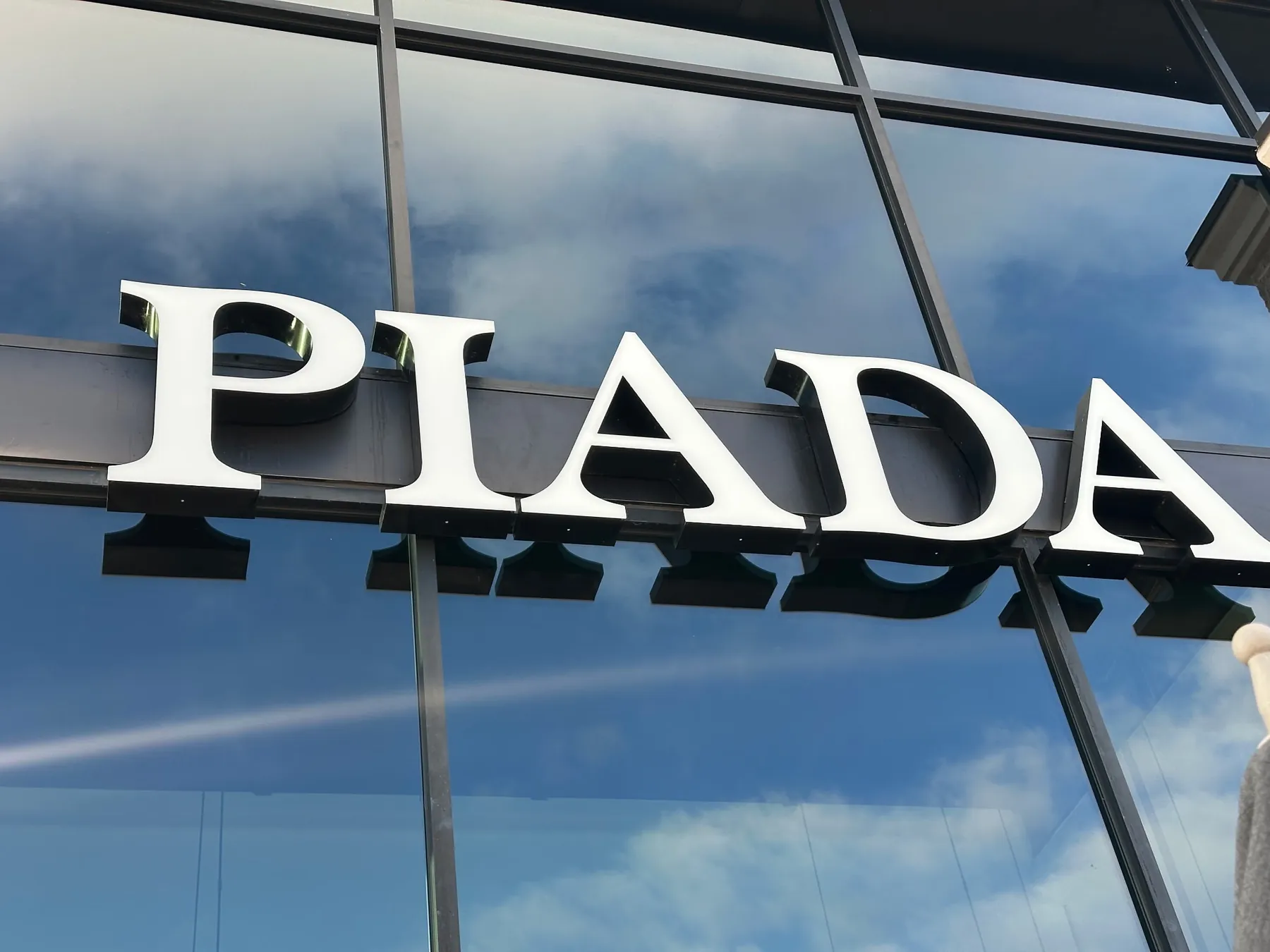 Clean Piada exterior sign after cobweb and debris detailing